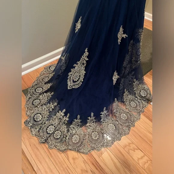 Blue mermaid style prom dress with gold detailing from Anny Lee. - Picture 3 of 5